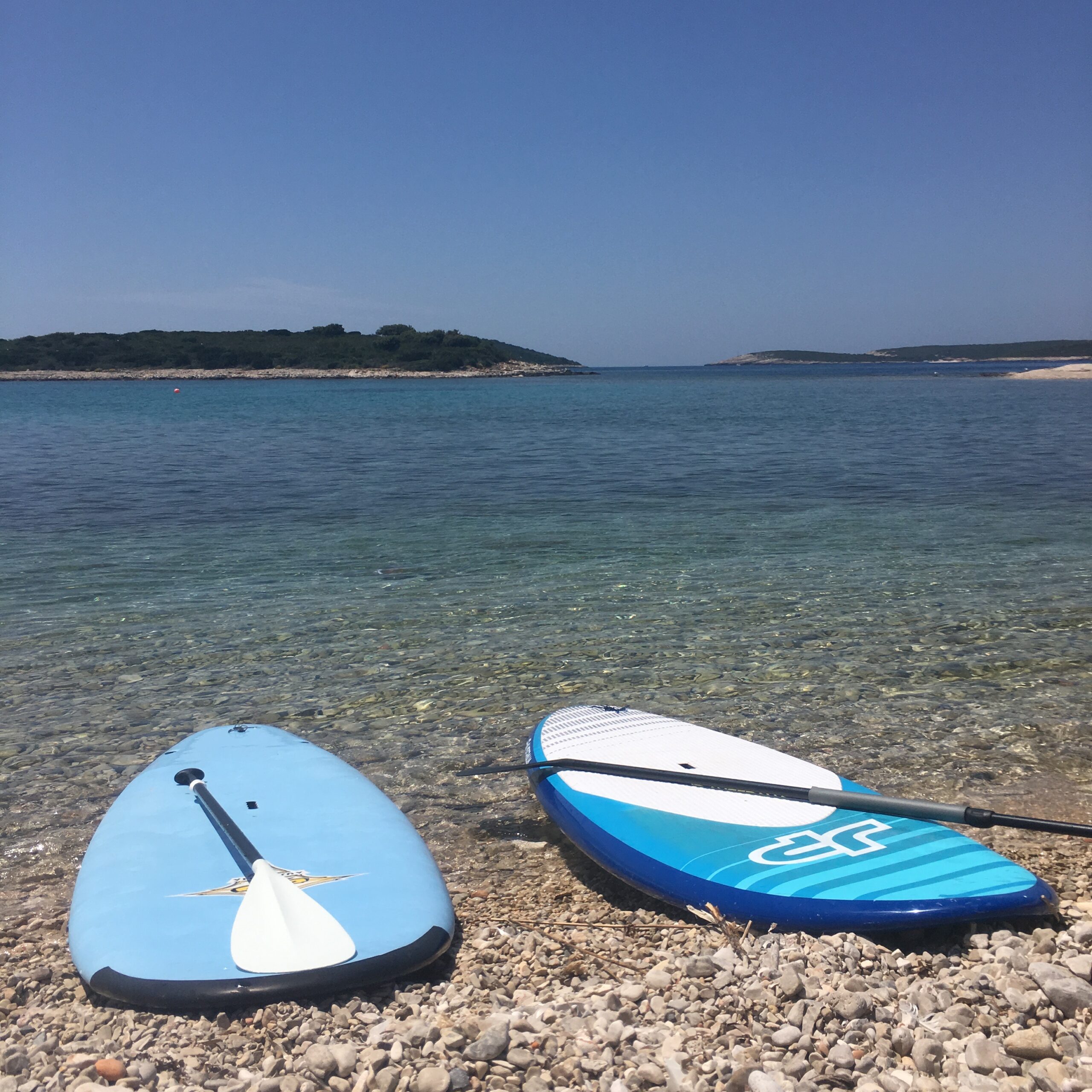 Stand up paddle boards and a view of the islets off of the southern coast of Vis.
