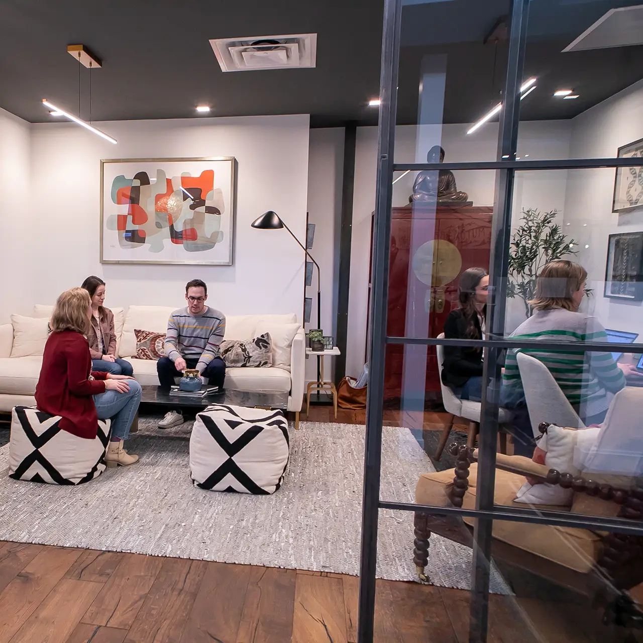 GFM|CenterTable team members work in the office's Leadership Lounge.
