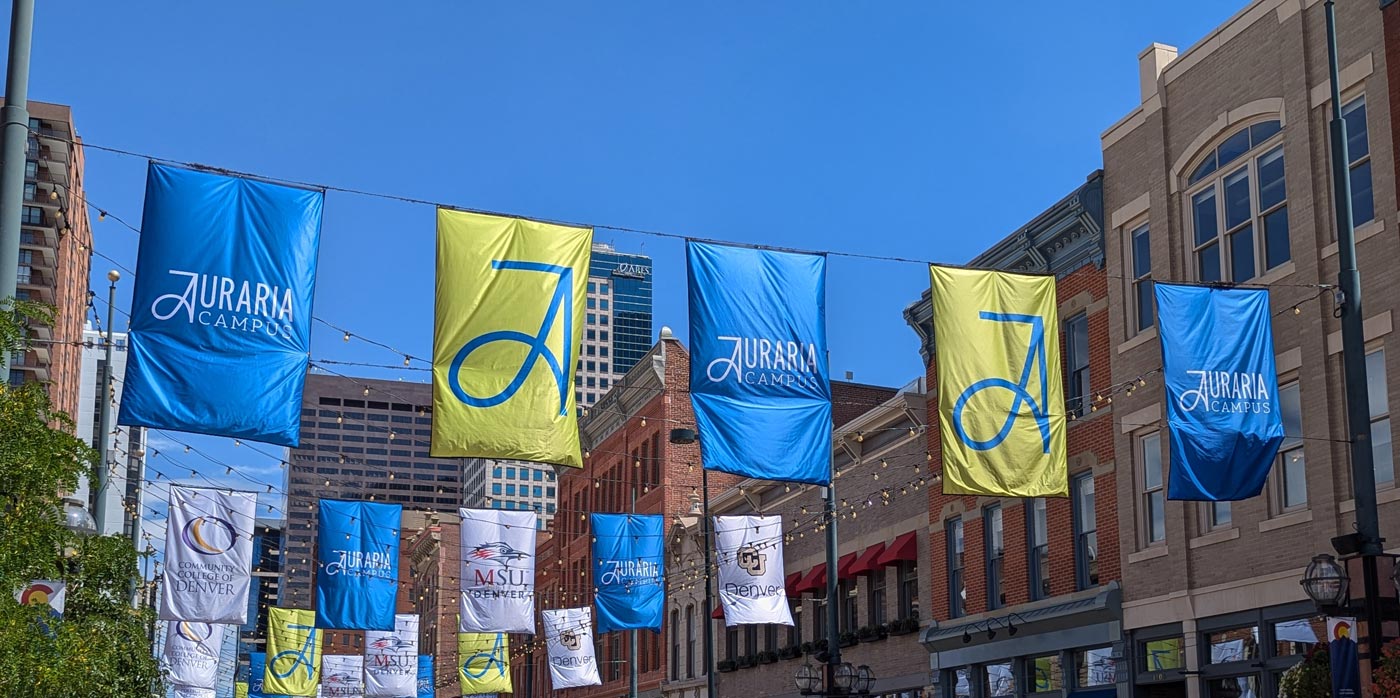 Banners with the new Auraria Campus branding hang over Larimer Street in Denver