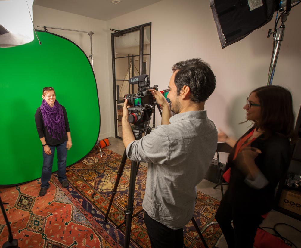 Team members test out the green screen in GFM|CenterTable's production studio