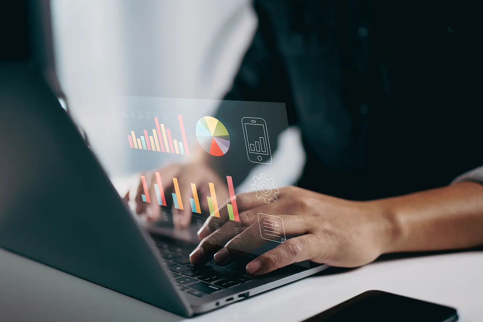 A person looking at a metrics dashboard on their laptop